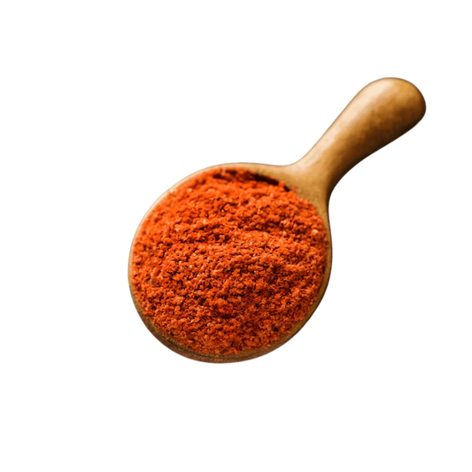 Assaisonnement Tout en 1 Tomate JUMBO en poudre rouge dans une cuillère en bois, parfait pour soupes et plats mijotés - ÉPICERIE SALÉE.