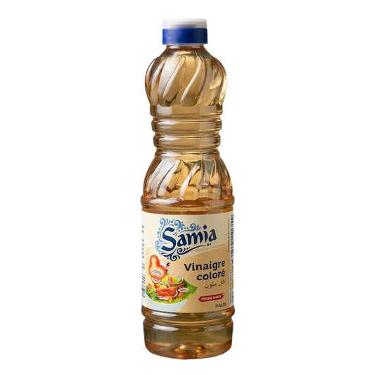 Halal gekleurde azijn SAMIA in een plastic fles van 500 mL met groenten op het etiket.
