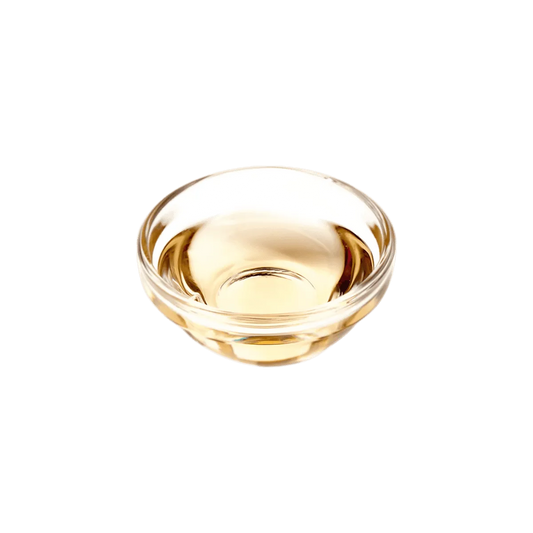Bol en verre contenant du vinaigre coloré halal SAMIA, parfait pour la cuisine créative. Ingrédient d'épicerie salée pour sauces et plats variés.